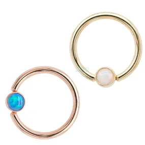 Captive Bead Ring (CBR) in Gold with Bezel-set Fuchsia Opal Captive Bead