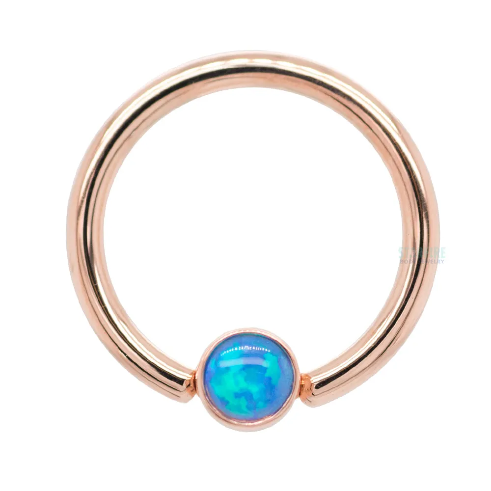 Captive Bead Ring (CBR) in Gold with Bezel-set Fuchsia Opal Captive Bead